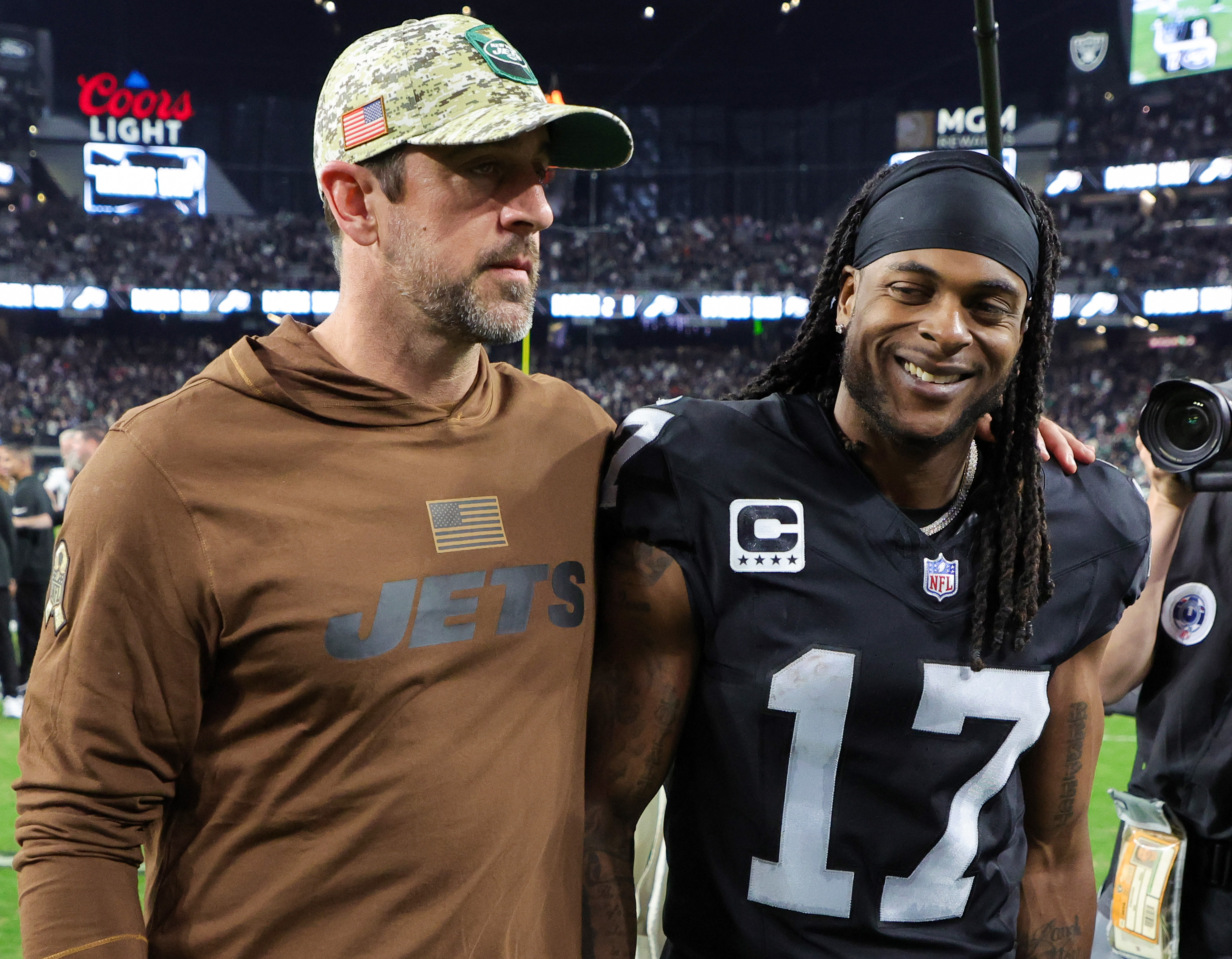 Quarterback Aaron Rodgers #8 of the New York Jets and wide receiver Davante Adams #17 of the Las Vegas Raiders visit on the field after the Raiders’ 16-12 victory over the Jets at Allegiant Stadium on November 12, 2023 in Las Vegas, Nevada.