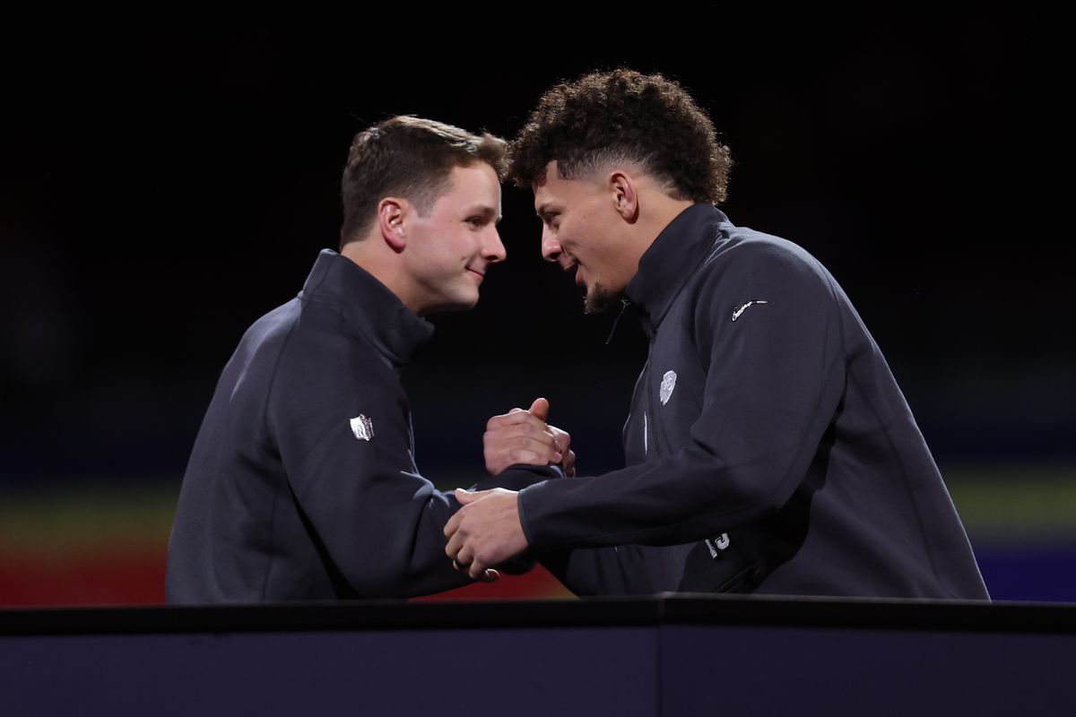 Brock Purdy #13 of the San Francisco 49ers and Patrick Mahomes #15 of the Kansas City Chiefs shake hands during Super Bowl LVIII Opening Night at Allegiant Stadium on February 5, 2024 in Las Vegas, NV.