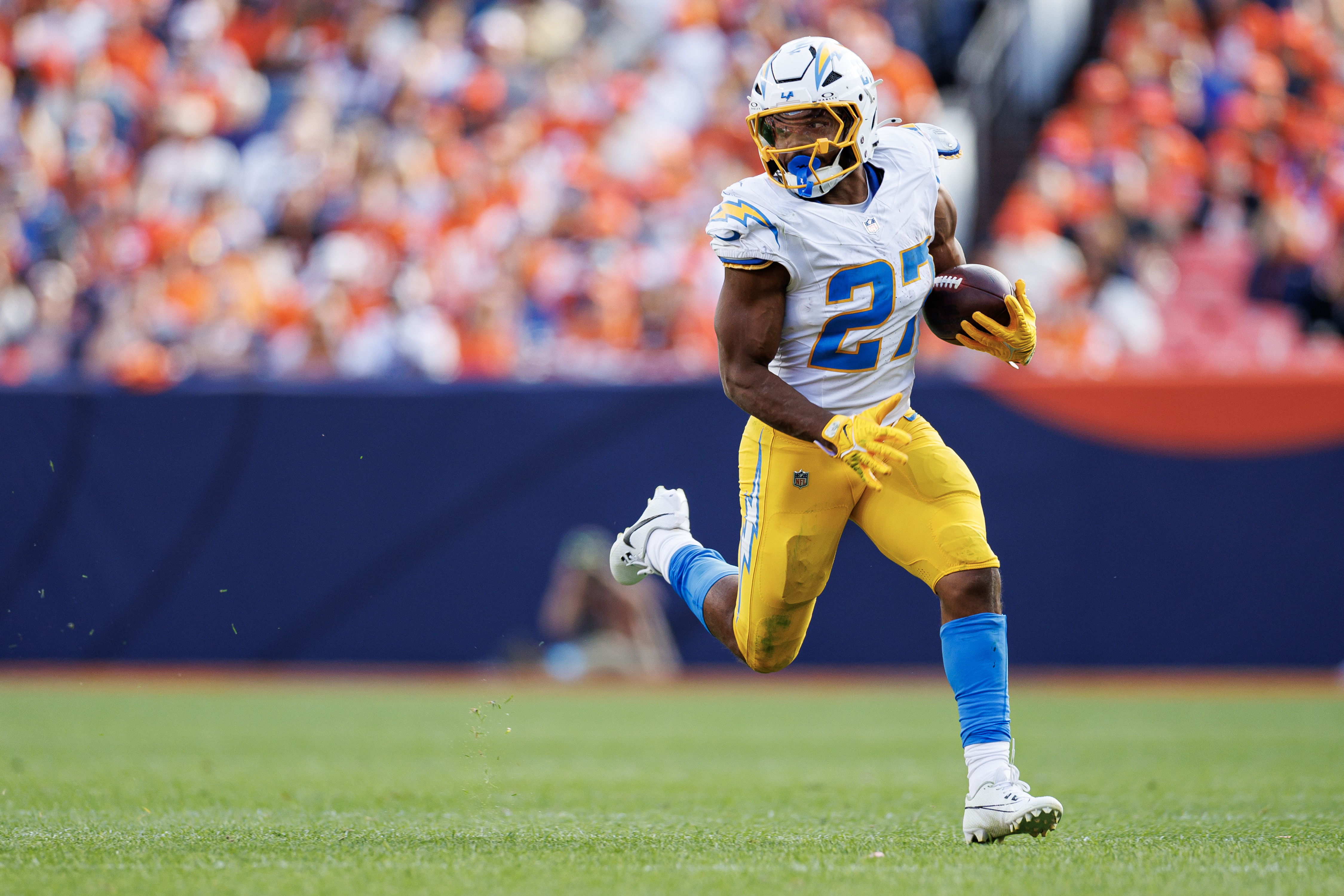 &nbsp;Running back J.K. Dobbins #27 of the Los Angeles Chargers carries the ball during the third quarter of an NFL football game against the Denver Broncos at Empower Field at Mile High on October 13, 2024 in Denver, Colorado.